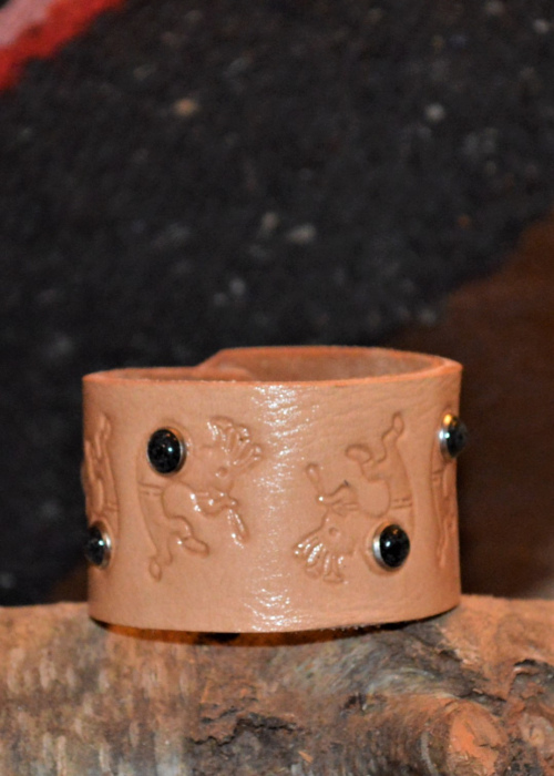 1 1/2" leather cuff bracelet w/ Kokopelli design and black stone rivets